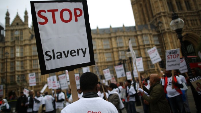 LONDON, ENGLAND - OCTOBER 18:  Anti-slavery activists rally outside Parliament on October 18, 2013 in London, England. Anti-slavery day falls on October 18th every year and provides an opportunity to draw attention to the scale and scope of human trafficking.  (Photo by Peter Macdiarmid/Getty Images)