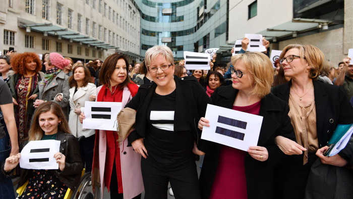 Carrie Gracie (centre) and BBC employees gather outside Broadcasting House in London on International Women's Day to call for equal pay
