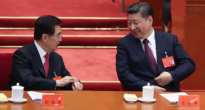 BEIJING, CHINA - OCTOBER 18: Chinese President Xi Jinping (R) talk with Hu Jintao, China's former president (L) duirng the opening session of the Chinese Communist Party's Congress at the Great Hall of the People on October 18, 2017 in Beijing, China. The 19th Communist Party Congress will convene from October 18-24. (Photo by Lintao Zhang/Getty Images)