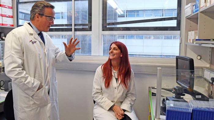 David Cameron speaks with Marian Fernandez, an Associate Biologist, during a tour of the Cambridge Drug Discovery Institute at Addenbrookes Hospital in Cambridge, after he has was announced as the new President of Alzheimer's Research UK. Taken on 25 January 2017