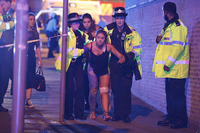 © Licensed to London News Pictures. 22/05/2017. Manchester, UK. Police and other emergency services are seen near the Manchester Arena after reports of an explosion. Police have confirmed they are responding to an incident during an Ariana Grande concert at the venue. Photo credit: Joel Goodman/LNP