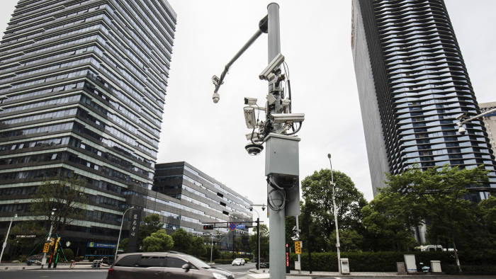 Surveillance cameras manufactured by Hangzhou Hikvision Digital Technology Co. are mounted on a post at a testing station near the company's headquarters in Hangzhou, China, on Tuesday, May 28, 2019. Hikvision, which is controlled by the Chinese government, is one of the leaders in the market for surveillance technology, with cameras that can produce sharp, full-color images in fog and near-total darkness. Photographer: Qilai Shen/Bloomberg