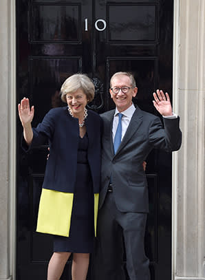 LONDON, ENGLAND - JULY 13:  Theresa May and husband Philip John May enter 10 Downing Street on July 13, 2016 in London, England. Former Home Secretary Theresa May becomes the UK's second female Prime Minister after she was selected unopposed by Conservative MPs to be their new party leader. She is currently MP for Maidenhead.  (Photo by Karwai Tang/Getty Images)