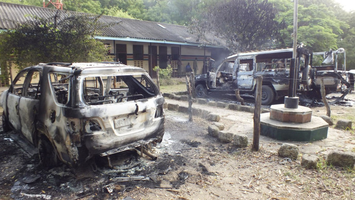 Wreckages of burnt cars are seen outside the Mpeketoni police station after unidentified gunmen attacked the coastal Kenyan town of Mpeketoni, June 16, 2014. At least 48 people were killed and others wounded when more than two dozen unidentified gunmen attacked a coastal Kenyan town overnight, police and the Kenya Red Cross said on Monday. REUTERS/Asuu Asuu (KENYA - Tags: SOCIETY CIVIL UNREST CRIME LAW)