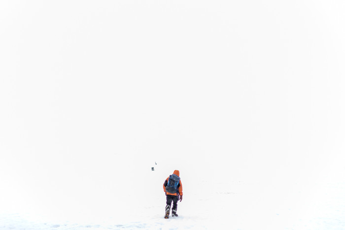 A researcher treks towards a British Antarctic Survey hut at Fossil Bluff
