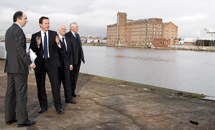 WIRRAL, UNITED KINGDOM - JANUARY 06: (L-R) Richard Mawdsley of Peel Holdings, Prime Minister David Cameron, Peter Nears of Peel Holdings and Lord Heseltine tour the £4.5 billion Wirral Waters development on January 6, 2011 in Wirral, England. Wirral Waters is one of Britain's biggest development schemes to regenerate the largely unused dock space. (Photo by Peter Byrne - WPA Pool/Getty Images)