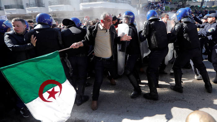 Police officers try to disperse people trying to reach the government palace during a protest against President Abdelaziz Bouteflika's plan to extend his 20-year rule by seeking a fifth term in April elections in Algiers, Algeria, March 1, 2019. REUTERS/Zohra Bensemra