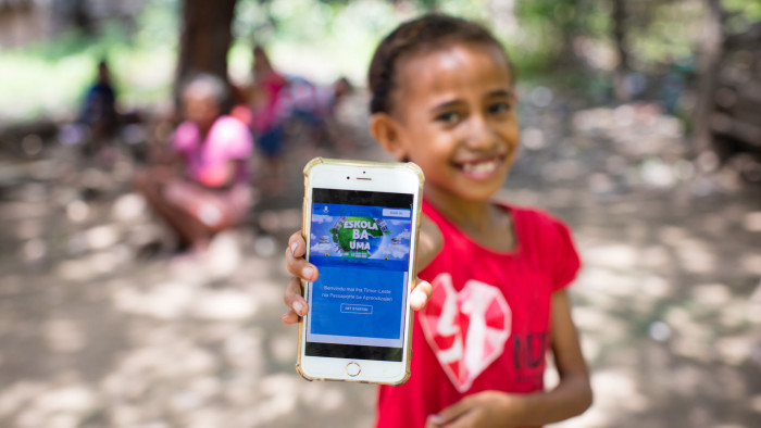 A journey of the mind: a girl in Timor-Leste, where schools closed because of Covid-19, uses the Learning Passport platform developed by Microsoft, UNICEF and the University of Cambridge