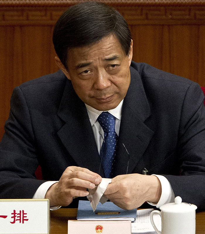 Bo Xilai...FILE - In this file photo taken on March 11, 2012, Chongqing party secretary Bo Xilai attends a plenary session of the National People's Congress at the Great Hall of the People in Beijing. A Chinese court said Sunday Aug. 18, 2013 that Bo Xilai, a rising Communist Party star who fell from power in a messy scandal, will go on trial Thursday on corruption charges. He was dismissed last year in a sandal that saw his wife convicted of killing a British businessman. (AP Photo/Andy Wong, File)