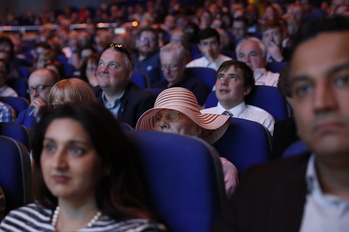 Attendees listen as Boris Johnson, former U.K. foreign secretary and U.K. Conservative party leadership candidate, not pictured, speaks during a hustings event in Birmingham, U.K., on Saturday, June 22, 2019. Front-runner Boris Johnson and Jeremy Hunt are facing Conservative party members for the first time since making it to a two-man runoff to succeed U.K. Prime Minister Theresa May. Photographer: Darren Staples/Bloomberg