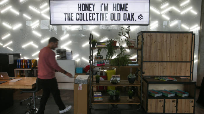 A employee is seen at the co-living building The Collective Old Oak in north west London on October 11, 2017. The 10-storey building may look like a hotel, but it is actually a large-scale house-share -- the biggest of its kind, according to its developers -- offering modest rooms and upscale services for hundreds of young adults caught in London's housing crisis. / AFP PHOTO / Daniel LEAL-OLIVAS / TO GO WITH AP STORY BY MARTINE PAUWELS (Photo credit should read DANIEL LEAL-OLIVAS/AFP/Getty Images)