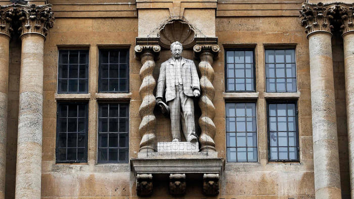 Cecil Rhodes surveys the scene from his vantage point on the facade of Oriel College, Oxford