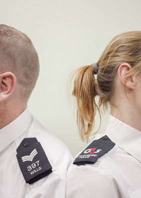 A branded epaulette is the only obvious difference between G4S support services employee Laura Greenley (right) and Sergeant Wills at Boston Police Station
