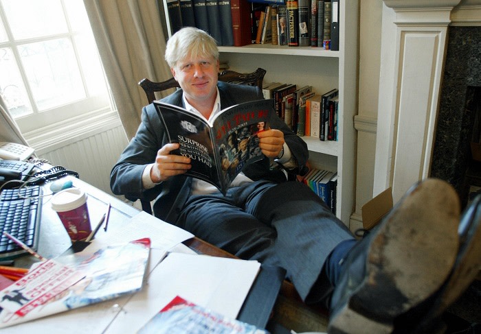 TO GO WITH STORY: LIFESTYLE-BRITAIN-MEDIA. The editor of The Spectator magazine, Boris Johnson, sits in his London office reading the anniversary issue of The Spectator marking 175 years of publication. AFP PHOTO/Jim WATSON (Photo credit should read JIM WATSON/AFP/Getty Images)