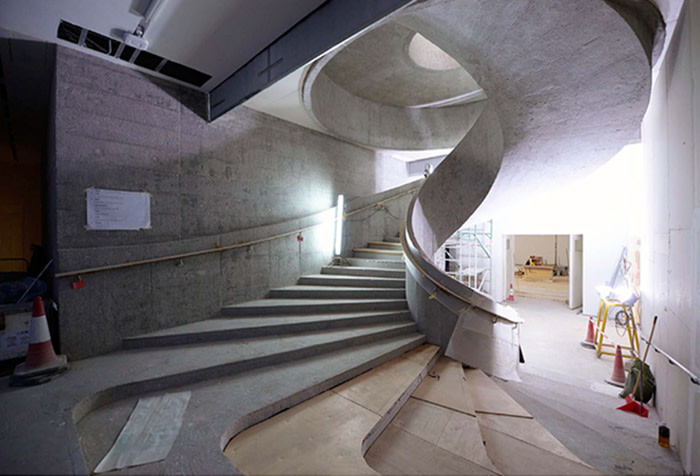 Sculptural concrete stairs add an expressive touch 