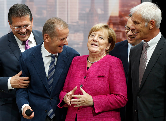 epaselect epa06203918 (L-R) EU Commission Vice-President in charge of Energy Union Maros Sefcovic, Member of the Board of Management of Volkswagen (VW) Herbert Diess, German Chancellor Angela Merkel, and president of the German Automobile Industry Association (VdA) Matthias Wissmann share a light moment as they visit the Volkswagen booth during Merkel's opening walk around at the International Motor Show IAA in Frankfurt, Germany, 14 September 2017. The International Motor Show IAA is the world's largest motor show and automobile exhibition. Exhibitors from about 40 countries present their latest products and innovations at the IAA, while hundreds of thousands of people are expected to visit the show from 14 to 24 September. EPA/FRIEDEMANN VOGEL