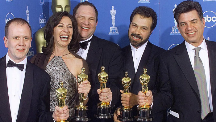 LOS ANGELES, UNITED STATES: Winners of the Oscar for Best Picture, &quot;Shakespeare in Love&quot;, pose for photographers 21 March 1999 at the Dorothy Chandler Pavilion in Los Angeles during the 71st Annual Academy Awards. From left are: David Parfitt, Dianna Gigliotti, Harvey Weinstein, Edward Zwick, and Marc Morman. (ELECTRONIC IMAGE) (Photo credit should read HECTOR MATA/AFP/Getty Images)