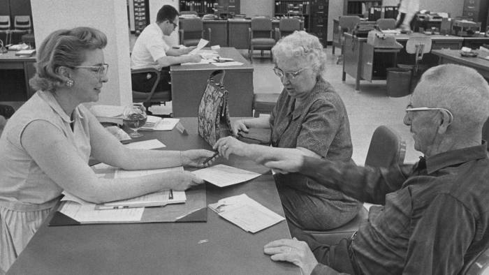 MAY 31 1966 Mr. and Mrs. George Whitehead, 4063 W. Eledorado Place, Sigh For Medicare Mrs. Amy Chester, Security claims representative, assists as deadline nears. Credit: Denver Post (Denver Post via Getty Images)