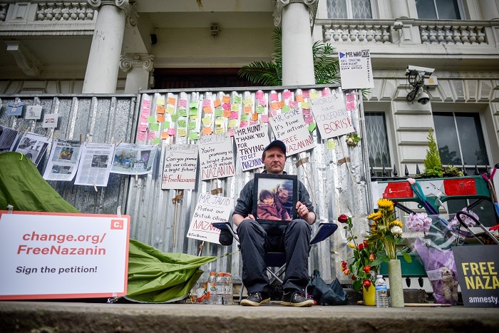 LONDON, ENGLAND - JUNE 20: Richard Ratcliffe holds a protest outside the Iranian embassy on June 20, 2019 in London, England. Richard Ratcliffe's British-Iranian wife, Nazanin Zaghari-Ratcliffe, was jailed in Iran in 2016 on spying charges, which she and the British government deny. She recently began a hunger strike to protest her continued detention at Evin prison in Tehran. (Photo by Peter Summers/Getty Images)