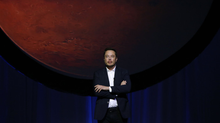 Elon Musk, chief executive officer for Space Exploration Technologies Corp. (SpaceX), pauses during the 67th International Astronautical Congress (IAC) in Guadalajara, Mexico, on Tuesday, Sept. 27, 2016. Musk delivered a keynote address at the conference titled &quot;Making Humans a Multiplanetary Species&quot; and tackled the technical challenges and &quot;potential architectures for colonizing the Red Planet.&quot; Photographer: Susana Gonzalez/Bloomberg