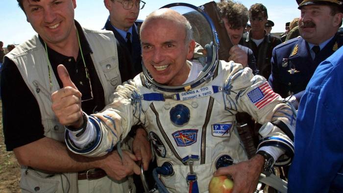 ARKALYK, KAZAKHSTAN: US space tourist Dennis Tito celebrates after his landing near the Kazakh town of Arkalyk (some 300 km from Astana), 06 May 2001. The world's first-ever space tourist Dennis Tito hailed a trip to Paradise after the US millionaire and two Russian cosmonauts successfully landed back on earth. AFP PHOTO/ ALEXANDER NEMENOV. (Photo credit should read ALEXANDER NEMENOV/AFP/Getty Images)