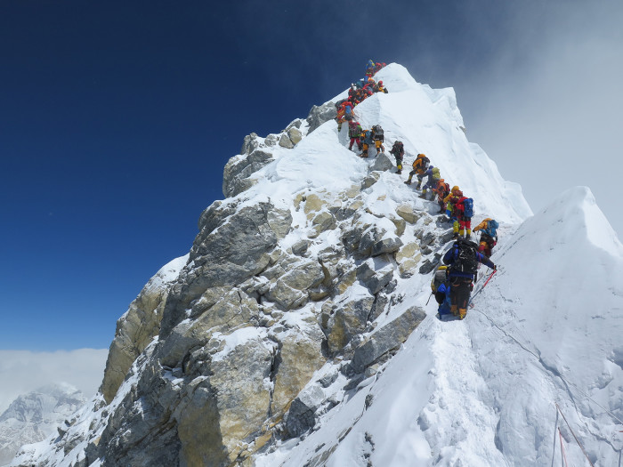 Climbers queue on what remains of the Hillary Step, just below the summit, shortly after 10am on May 16, 2018