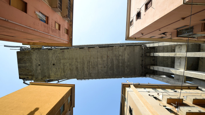 FILE PHOTO: A section of the collapsed Morandi Bridge is seen above, from the &quot;red zone&quot; restricted area in Genoa, Italy August 17, 2018. REUTERS/Massimo Pinca/File Photo