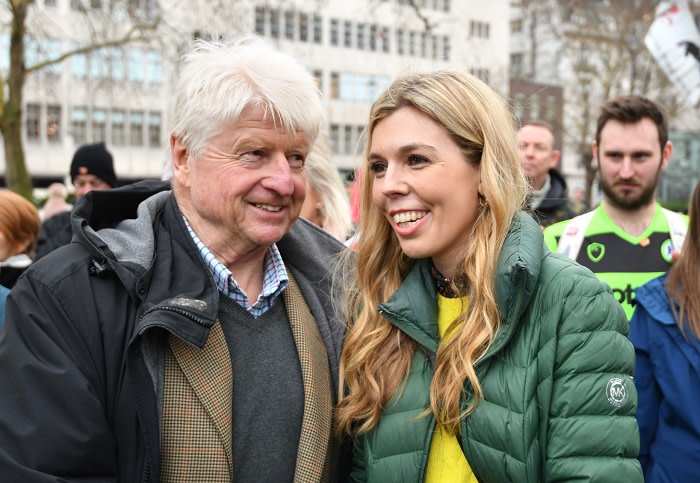 Stanley Johnson introduces himself to Carrie Symonds at an anti-whaling protest outside the Japanese Embassy in central London.