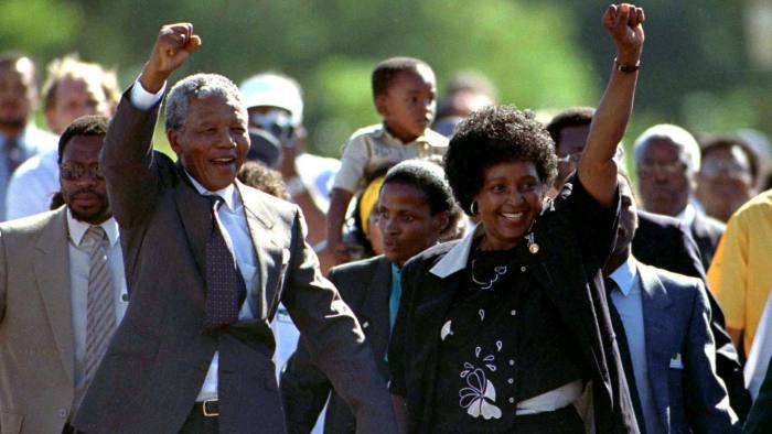 FILE PHOTO: President Nelson Mandela is accompanied by his then wife Winnie, moments after his release from prison near Paarl, South Africa, February 11, 1990. REUTERS/Ulli Michel/File Photo