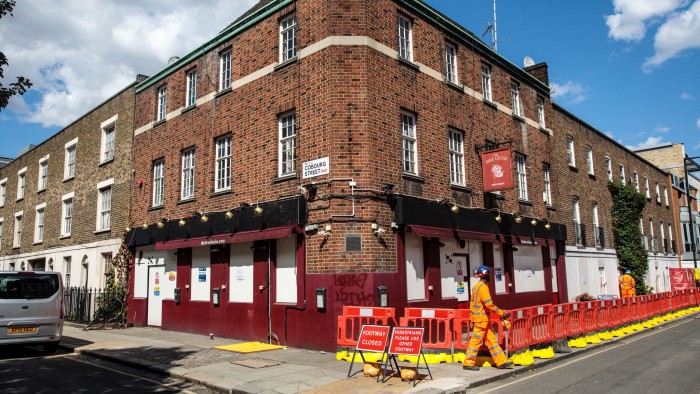 LONDON, ENGLAND - AUGUST 08: Construction workers outside the now-closed Bree Louise pub after it was shut to make way for the HS2 railway project earlier this year on August 8, 2018 in London, United Kingdom. Pubs in the UK are closing at a rate of 18 a week according to the latest industry figures. The statistic is said to be linked to the rising cost of alcohol, which has seen an increasing number of people choose to drink at home. (Photo by Jack Taylor/Getty Images)