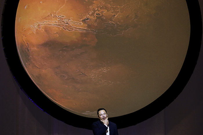 Elon Musk, chief executive officer for Space Exploration Technologies Corp. (SpaceX), pauses while speaking during the 67th International Astronautical Congress (IAC) in Guadalajara, Mexico, on Tuesday, Sept. 27, 2016. Musk's vision for building a self-sustaining city on Mars will require full rocket reusability, refueling the spacecraft in orbit and propellant production on the Red Planet. Photographer: Susana Gonzalez/Bloomberg