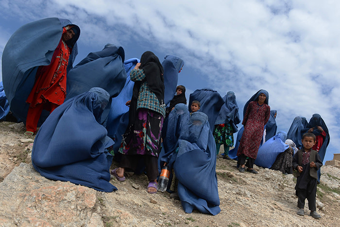 (FILES) In this file photo taken on May 5, 2014 Afghan villagers are pictured near the scene in the landslide-hit Aab Bareek village in Argo district of Badakhshan province.
Agence France-Presse's chief photographer in Kabul, Shah Marai, was killed April 30, AFP has confirmed, in a secondary explosion targeting a group of journalists who had rushed to the scene of a suicide blast in the Afghan capital. Marai joined AFP as a driver in 1996, the year the Taliban seized power, and began taking pictures on the side, covering stories including the US invasion in 2001. In 2002 he became a full-time photo stringer, rising through the ranks to become chief photographer in the bureau. He leaves behind six children, including a newborn daughter.

  / AFP PHOTO / Shah MARAISHAH MARAI/AFP/Getty Images