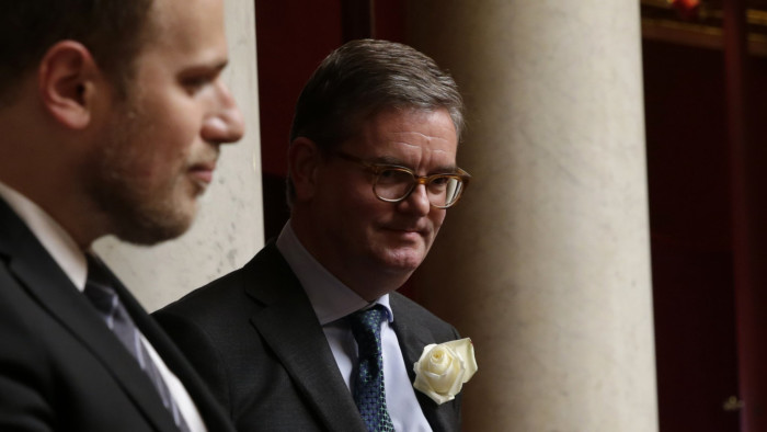 British Ambassador to France Julian King (R) holds, along French deputies and government members, a moment of silence for slain British Labour party MP Joe Cox during the questions to the government session on June 21, 2016 at the French National Asssembly in Paris. / AFP PHOTO / Thomas SAMSON