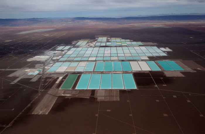 An aerial view shows the brine pools of SQM lithium mine on the Atacama salt flat in the Atacama desert of northern Chile, January 10, 2013. Picture taken January 10, 2013. REUTERS/Ivan Alvarado - RC1FE8C73F10