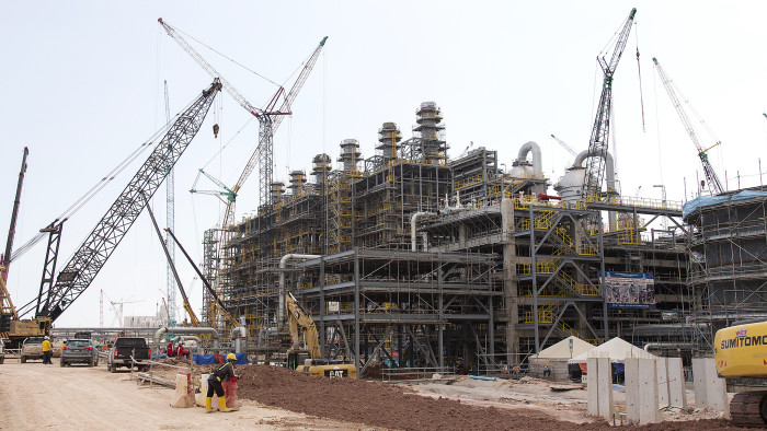 Cranes operate at a steam cracker unit at the under construction Petronas Nasional Berhad (Petronas) Refinery and Petrochemical Integrated Development (Rapid) Project, part of the Pengerang Intergrated Complex PIC), in Johor, Malaysia, on Thursday, March 15, 2018. The Pengerang refining complex is &quot;in good shape&quot; for start-up in the first-quarter of next year, with an aim to achieve stable operations by the third-quarter, said Petronas Refinery and Petrochemical Corp. Chief Executive Officer Colin Wong in an interview with Bloomberg on March 12. Photographer: Ore Huiying/Bloomberg