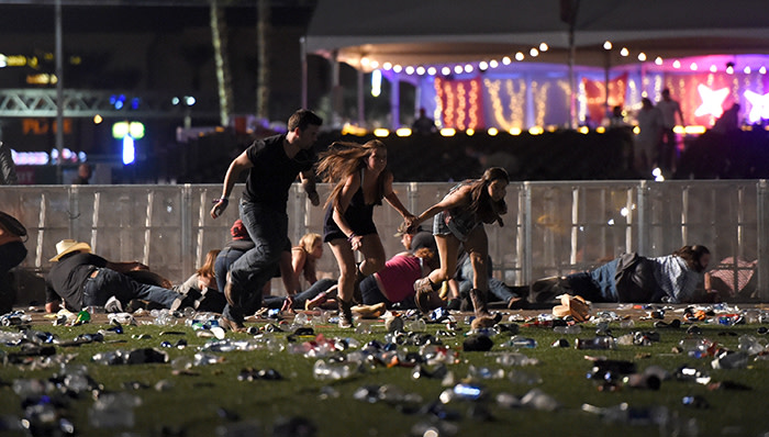 LAS VEGAS, NV - OCTOBER 01 People run from the Route 91 Harvest country music festival after apparent gun fire was heard on October 1, 2017 in Las Vegas, Nevada. There are reports of an active shooter around the Mandalay Bay Resort and Casino. (Photo by David Becker/Getty Images)