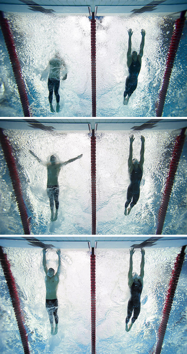Underwater view of USA Michael Phelps (L) and Serbia Milorad Cavic (R) in action, touching wall to finish Men's 100M Butterfly Final at the 2008 Beijing Olympic Games
