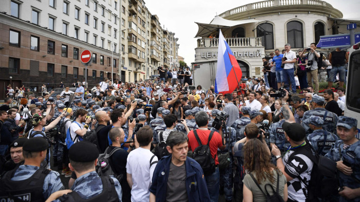 Protesters gather as they take part in a march to protest against the alleged impunity of law enforcement agencies in central Moscow on June 12, 2019. - More than 200 people including opposition leader Alexei Navalny were detained as police sought to break up a peaceful Moscow rally against the alleged impunity of law enforcement agencies. Russian police in riot gear moved in against the unsanctioned march of more 1,000 people amid screams of protesters shouting &quot;you are criminals&quot; and &quot;stop police terror.&quot; (Photo by Alexander NEMENOV / AFP)ALEXANDER NEMENOV/AFP/Getty Images