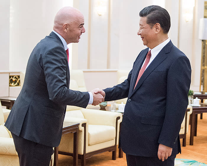 China's President Xi Jinping (R) shakes hands with FIFA President Gianni Infantino at the Great Hall of the People in Beijing on June 14, 2017. Chinese President Xi Jinping met with FIFA chief Gianni Infantino on June 14 as the football world watches for signs that the Asian giant will make a bid to host a World Cup. / AFP PHOTO / POOL / Fred DUFOUR (Photo credit should read FRED DUFOUR/AFP/Getty Images)
