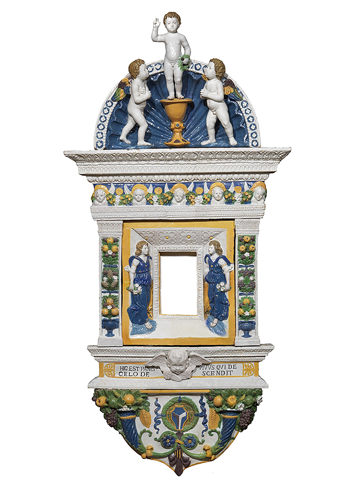 GIOVANNI Della ROBBIA (Florence, 1469–1529/30) Eucharistic Tabernacle with Jesus as a Child blessing, Angels and Cherubs Glazed polychrome terracotta