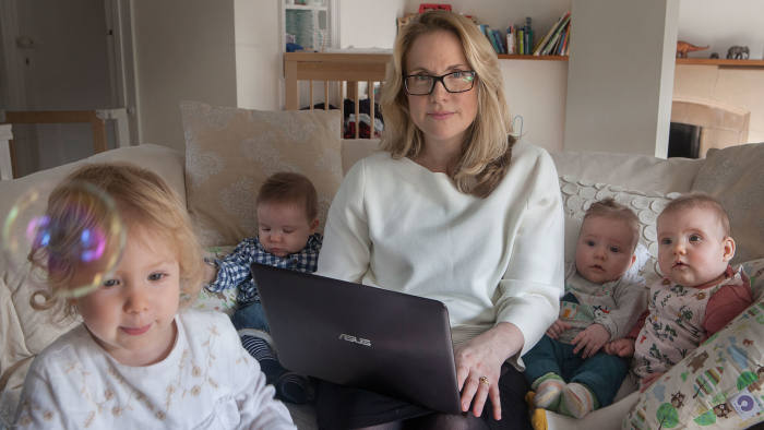 Sarah Cook working from home and looking after her 4 Children, 3 of whom are triplets. 12/10/16 . Copyright Photo Tom Pilston.
