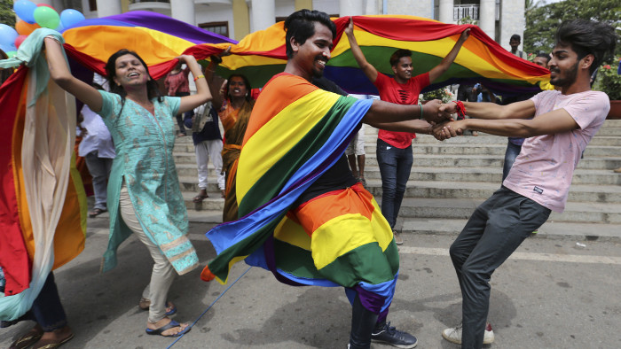 Members of the LGBT community dance to celebrate after the country's top court struck down a colonial-era law that made homosexual acts punishable by up to 10 years in prison, in Bangalore, India, Thursday, Sept. 6, 2018. The court gave its ruling Thursday on a petition filed by five people who challenged the law, saying they are living in fear of being harassed and prosecuted by police. (AP Photo/Aijaz Rahi)