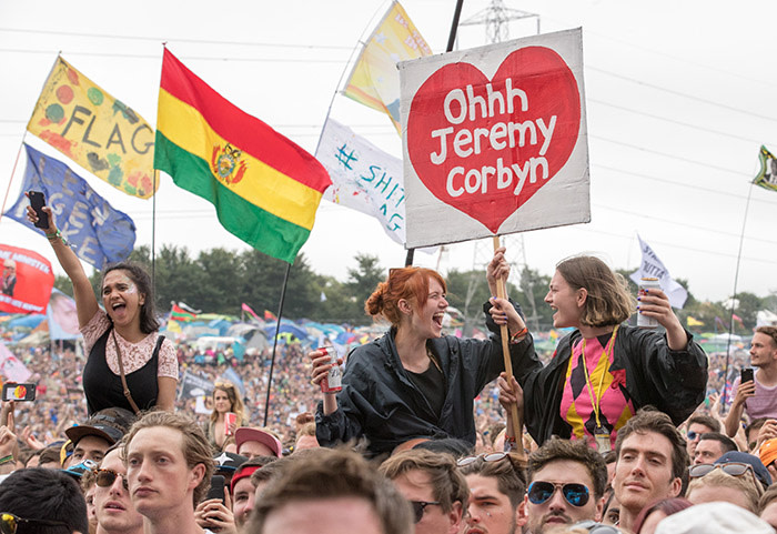GLASTONBURY, ENGLAND - JUNE 24: Crowds cheer Labour Party leader Jeremy Corbyn address the crowd from the main stage a the Glastonbury Festival site at Worthy Farm in Pilton on June 24, 2017 near Glastonbury, England. Glastonbury Festival of Contemporary Performing Arts is the largest greenfield festival in the world. It was started by Michael Eavis in 1970 when several hundred hippies paid just £1, and now attracts more than 175,000 people. (Photo by Matt Cardy/Getty Images)