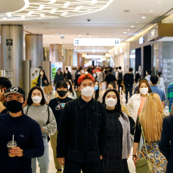 People wear masks to avoid the spread of the coronavirus disease (COVID-19) at a department store in Seoul, South Korea April 30, 2020. REUTERS/Kim Hong-Ji