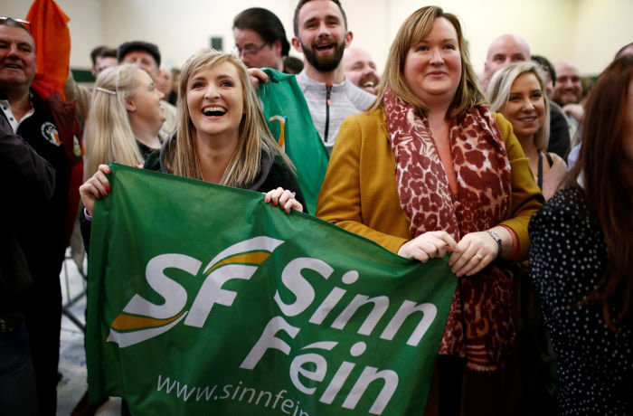 Sinn Fein supporters react after exit polls were announced in Ireland's national election, in Cork, Ireland, February 9, 2020. REUTERS/Henry Nicholls