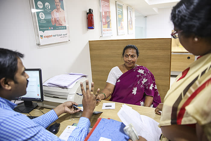 Customers are guided by Staff at the Koramangala branch of Ujjivan Bank in Bangalore, India.