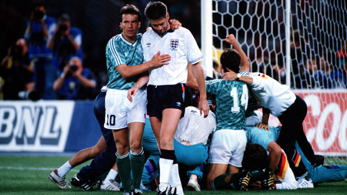 England's Chris Waddle is consoled by West German captain Lothar Matthaeus after his miss in the penalty shootout meant England were eliminated from the tournament in the World Cup semi-final in 1990