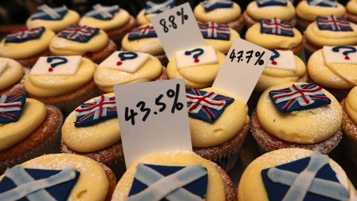 A view of cupcakes decorated with the Union and Scottish Saltire flags, and question marks, along with the results of sales, at Cuckoo's bakery, in Edinburgh, Scotland, Wednesday, Sept. 17, 2014. The bakery has been monitoring the sales of its Union and Saltire flag and undecided cupcakes for 200 days to try and predict the outcome of the referendum. 43.5 percent of sales were Yes cakes, 47.7 percent No, and 8.8 percent undecided. (AP Photo/Scott Heppell)