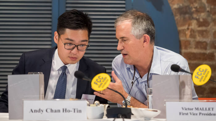 In this photo taken on August 14, 2018, Victor Mallet, a Financial Times journalist and vice president of the Foreign Correspondents' Club (FCC) (R) speaks with Andy Chan, founder of the Hong Kong National Party, during a luncheon at the FCC in Hong Kong. - Hong Kong has refused to renew the visa of a senior Financial Times journalist who hosted a talk by an activist advocating the city's independence from China, the newspaper said on October 5, 2018. (Photo by Paul Yeung / POOL / AFP) (Photo credit should read PAUL YEUNG/AFP/Getty Images)