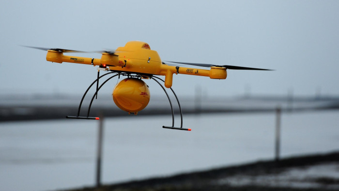 A quadrocopter remotely controlled DHL drone transporting medicines is pictured on November 18, 2014 in Norden-Norddeich prior its take off for the Juist island during a press presentation. AFP PHOTO / INGO WAGNER (Photo credit should read INGO WAGNER/AFP/Getty Images)